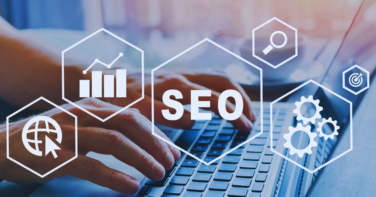 A close up of someone typing on a computer keyword. Graphics with SEO and charts are overlaid on the image.